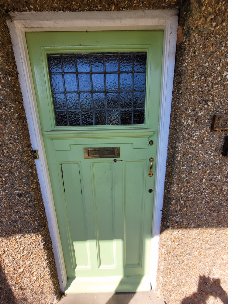 Front Door and Porch Restoration in Teal Facade, before